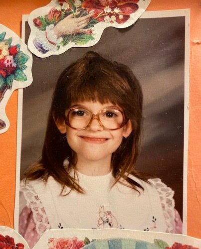 Girl with large glasses and homemade dress