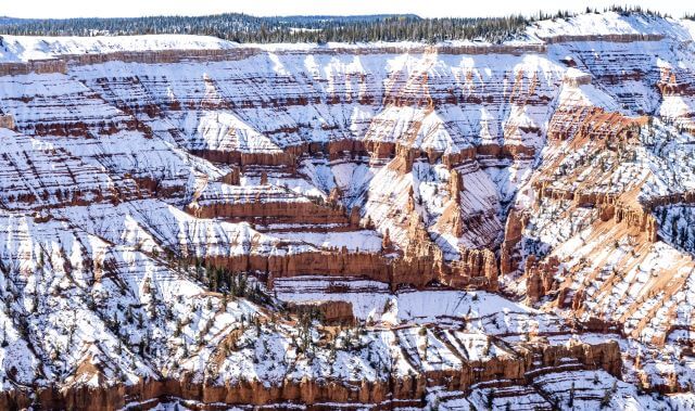 red rocks painted with snow