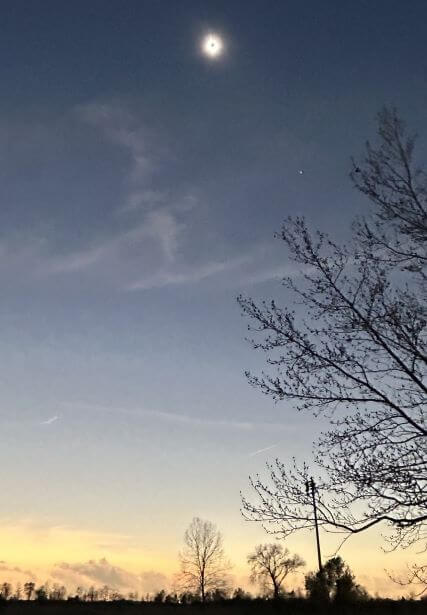 small bright moon with yellow horizon