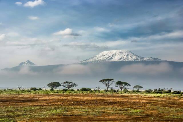high white mountain over savanna