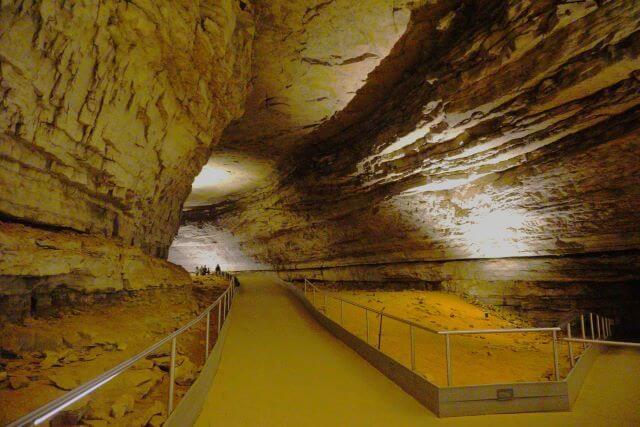 a lit path through a cave