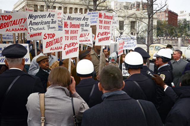 protestors in the 1960s holding signs
